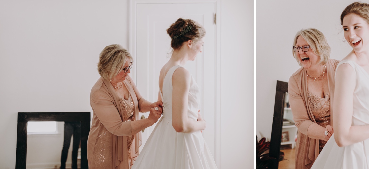 putting on the brides wedding dress. Minneapolis minnesota wedding photographer. 