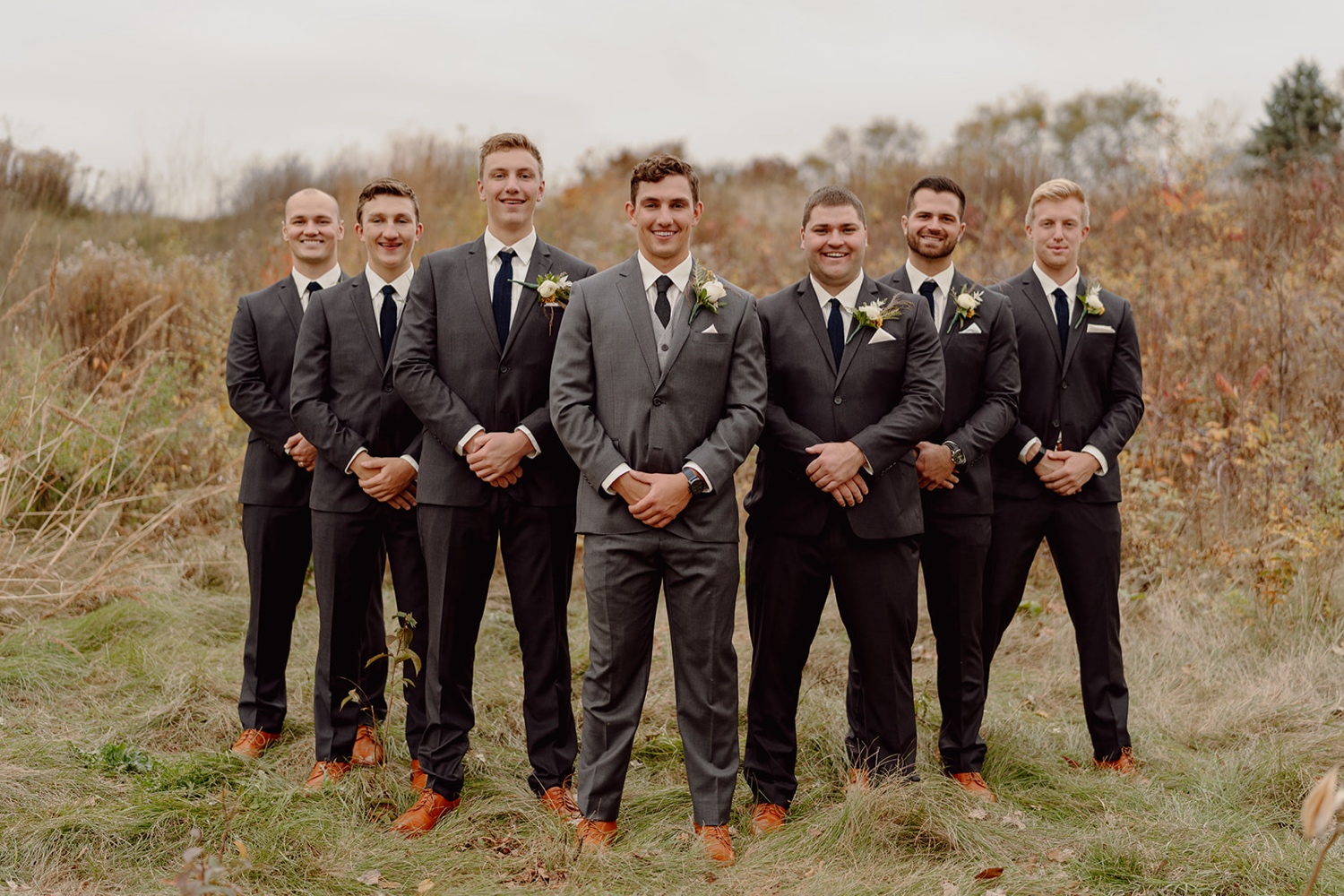 Moody navy and gold wedding party photos at Royal Golf club wedding in the fall. 