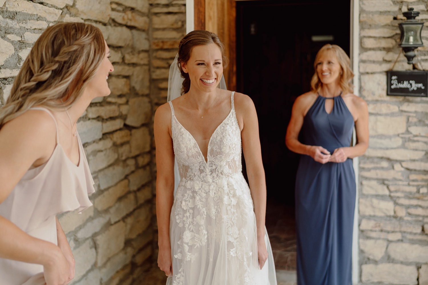 Bride getting ready for wedding at Mayowood Stone Barn in Rochester, Minnesota