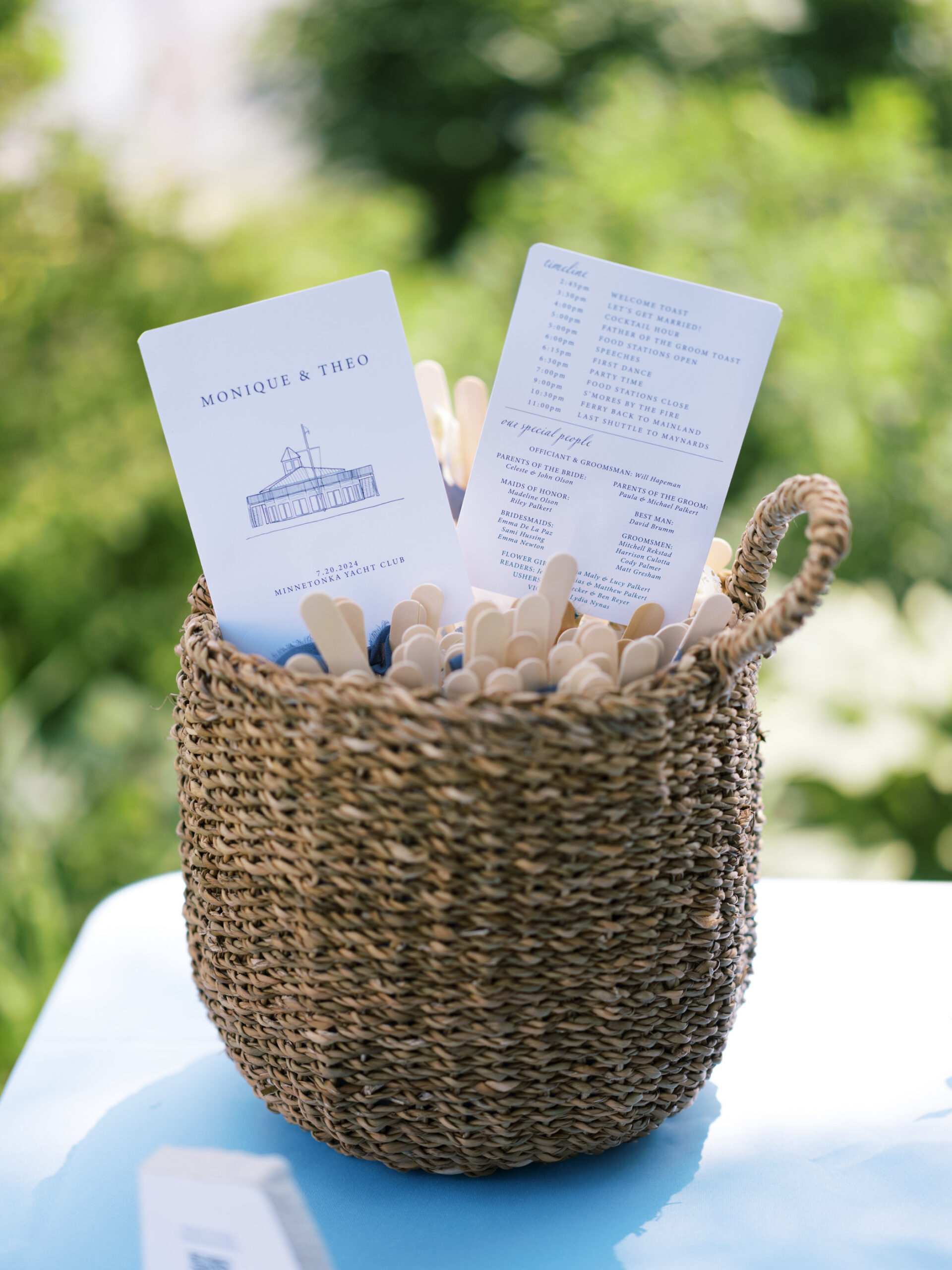wedding schedules in basket at lake minnetonka yacht club
