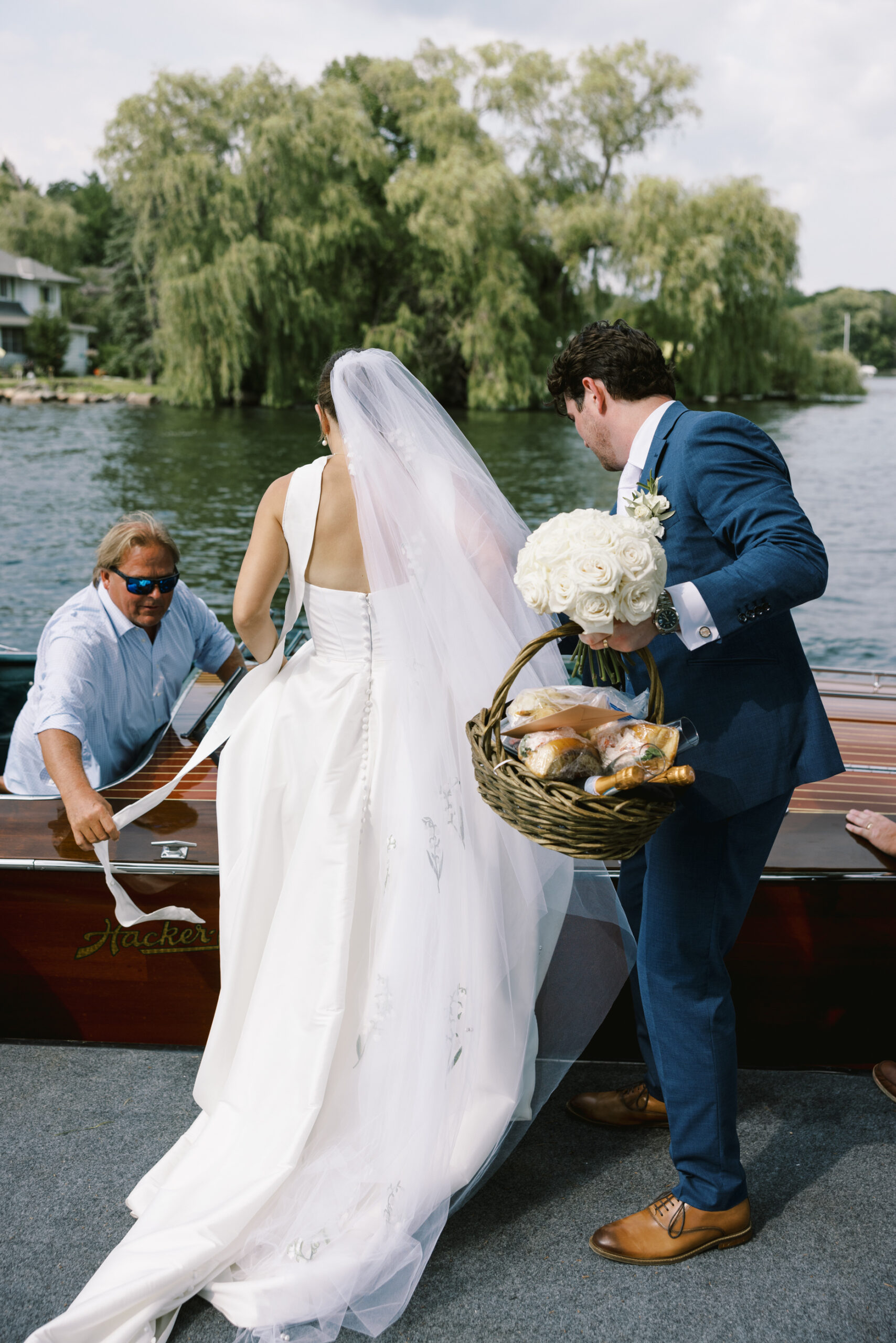 bride and groom getting in yacht at minnetonka yacht club wedding
