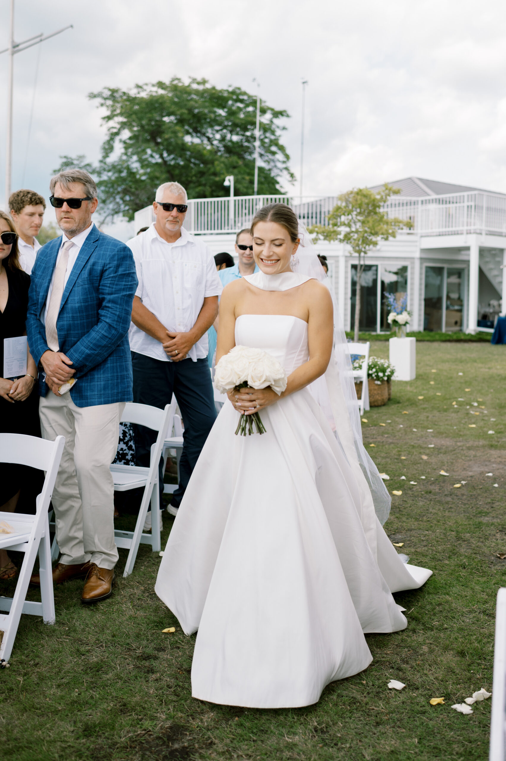bride walking down aisle at lake minnetonka yacht club