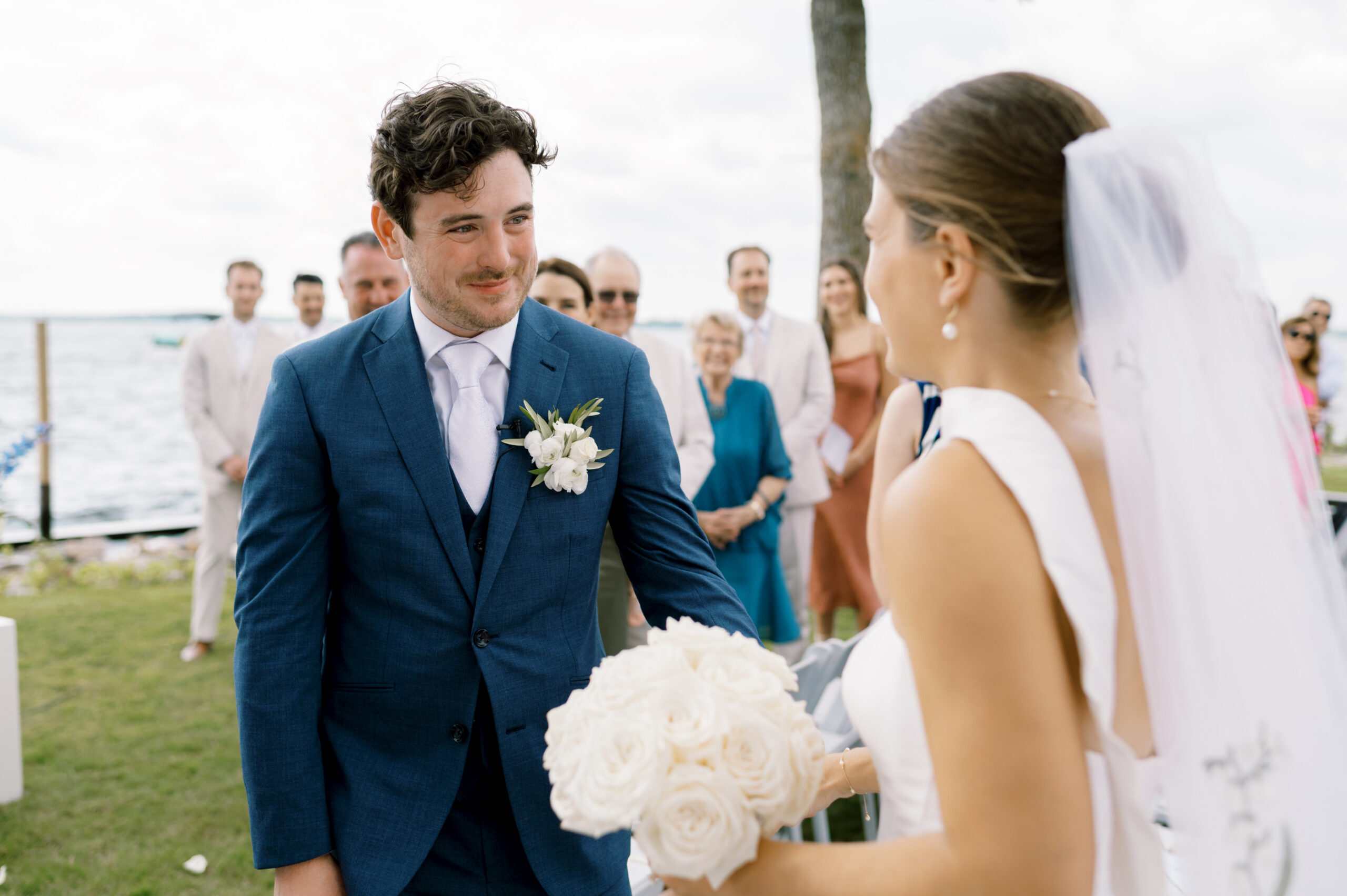 bride and groom smiling at each other at wedding at lake minnetonka yacht club
