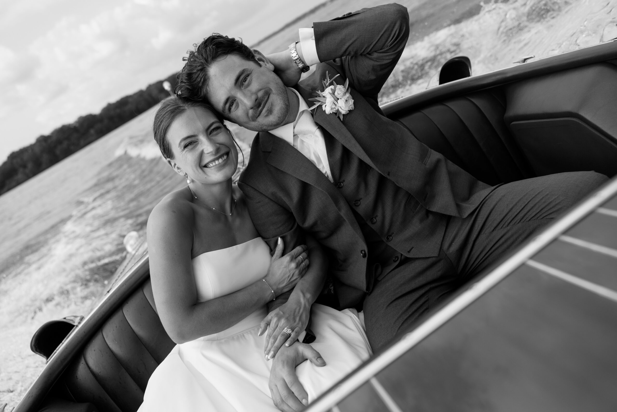 bride and groom smiling on a boat at minnetonka yacht club wedding
