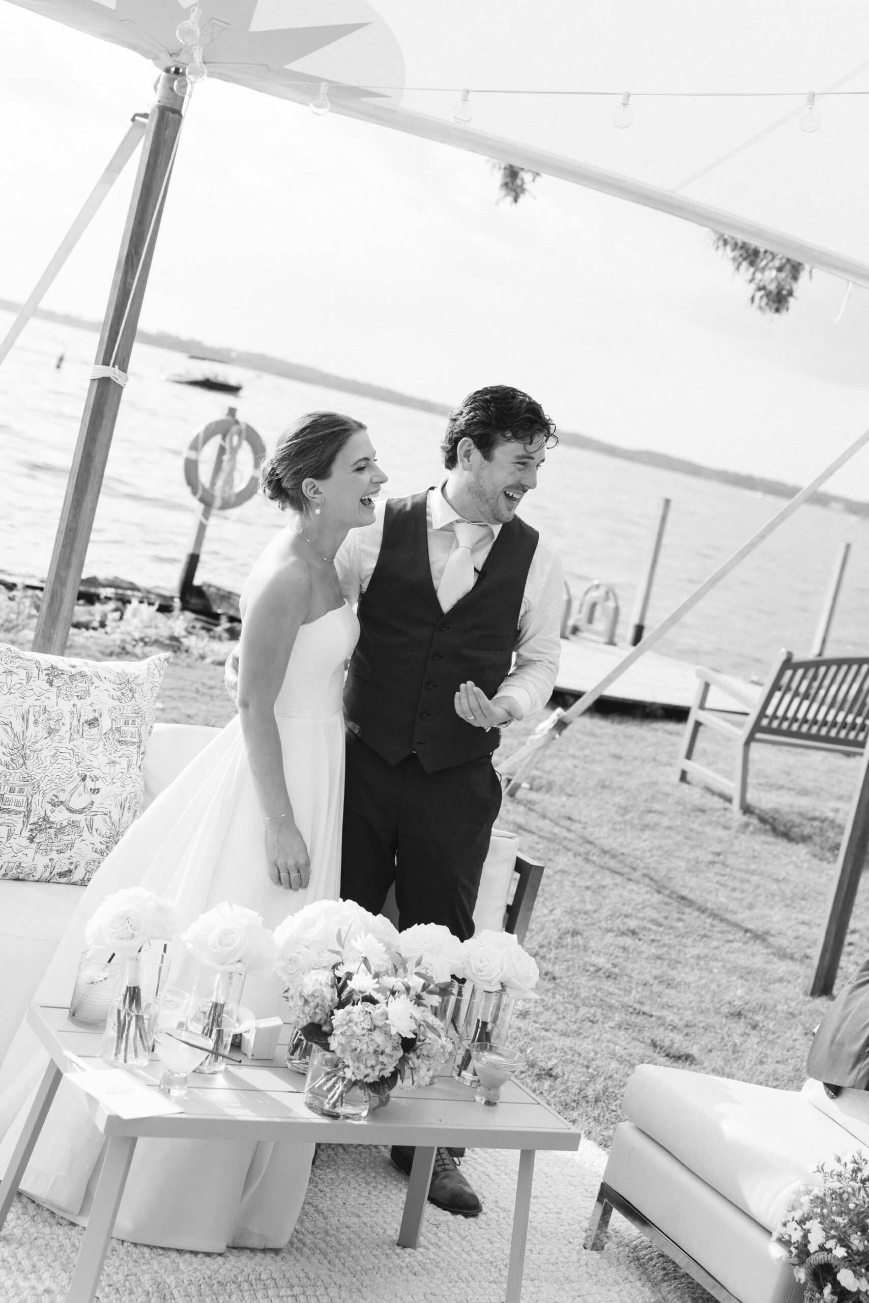 bride and groom laughing at minnetonka yacht club