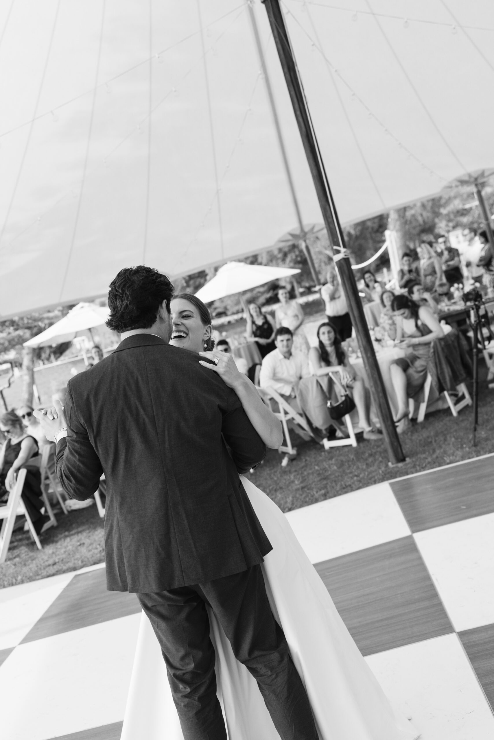 bride and groom laughing and dancing at minnetonka yacht club wedding