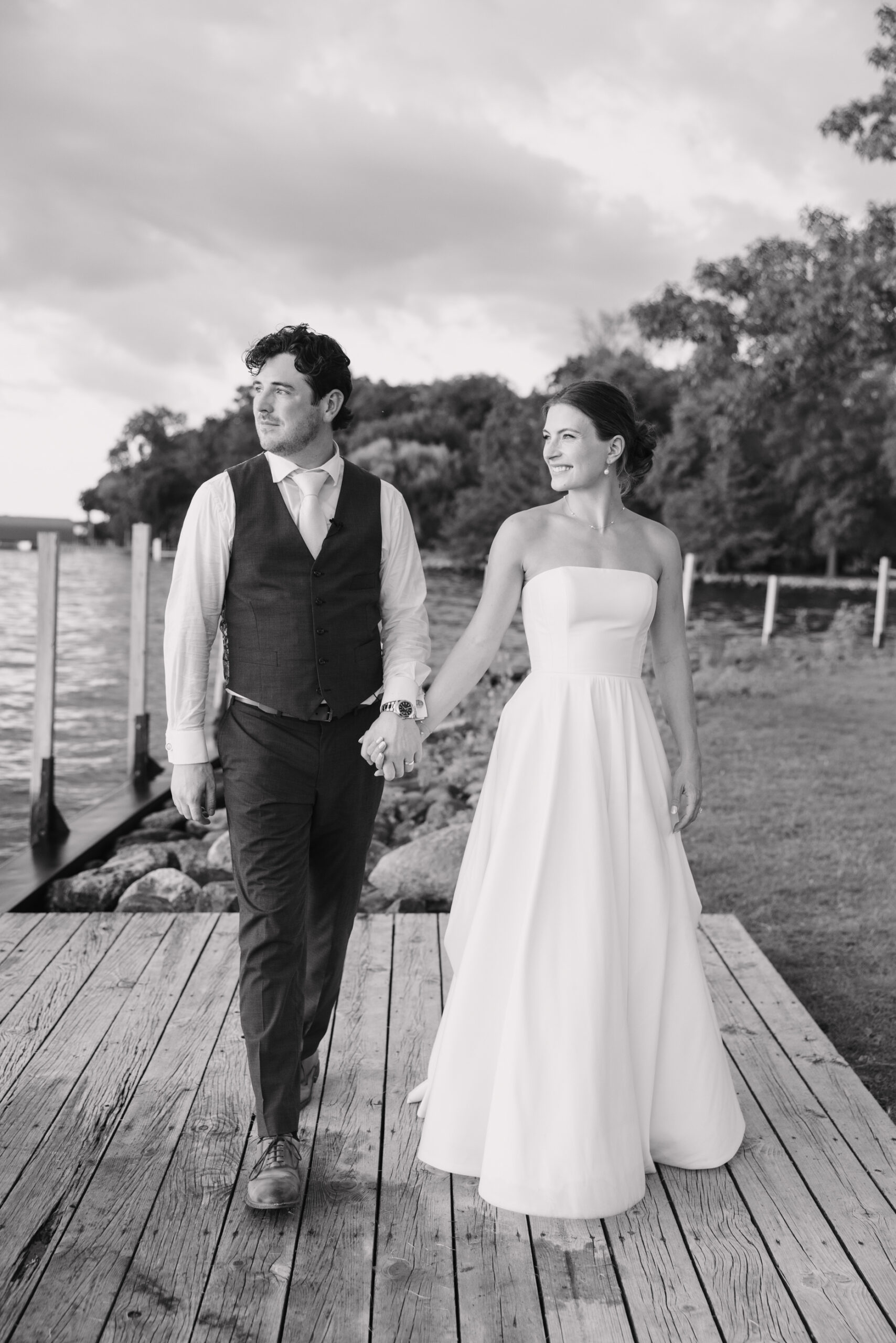 bride and groom looking at lake by lake minnetonka yacht club
