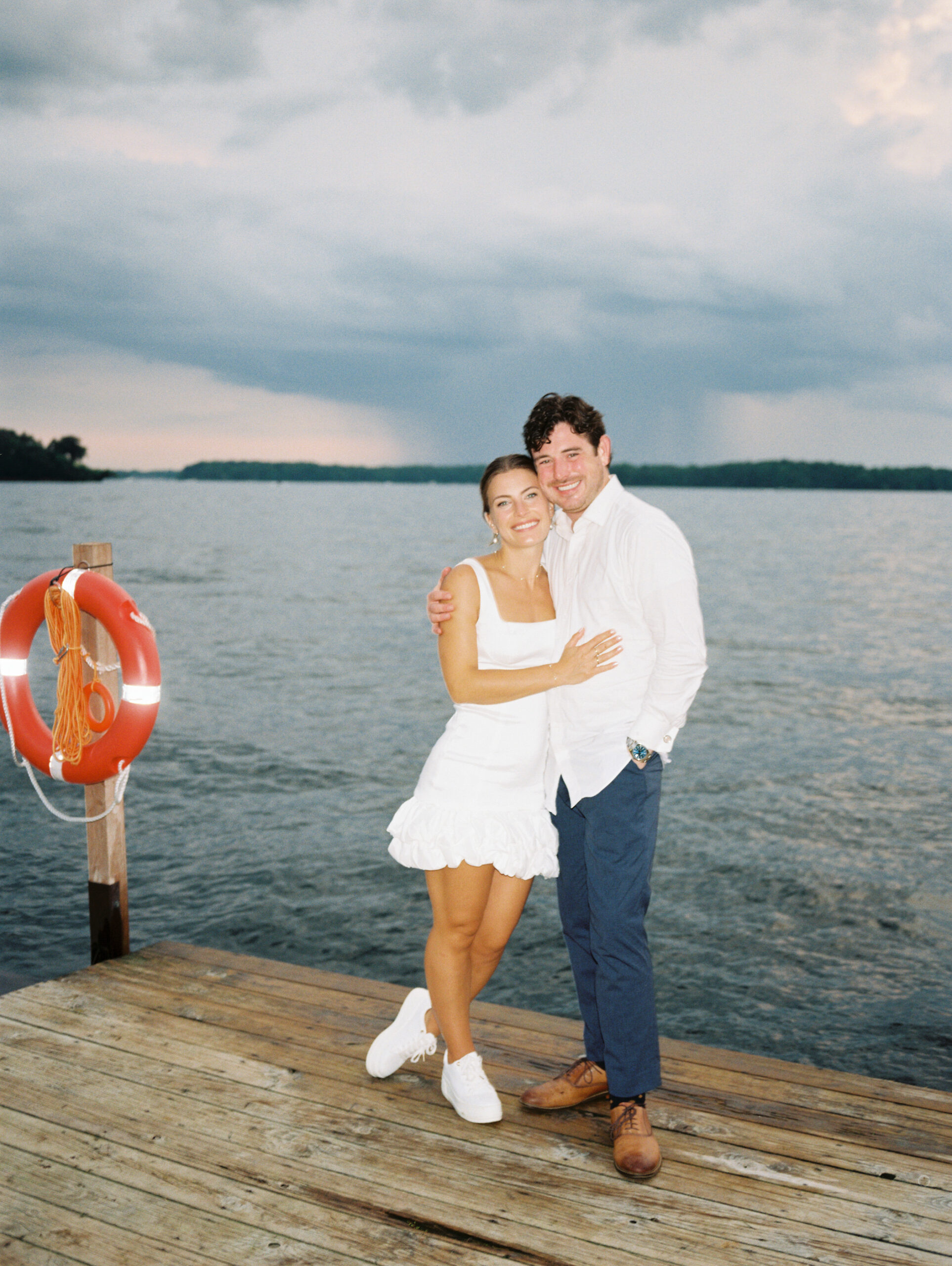 bride and groom after wedding at lake minnetonka yacht club
