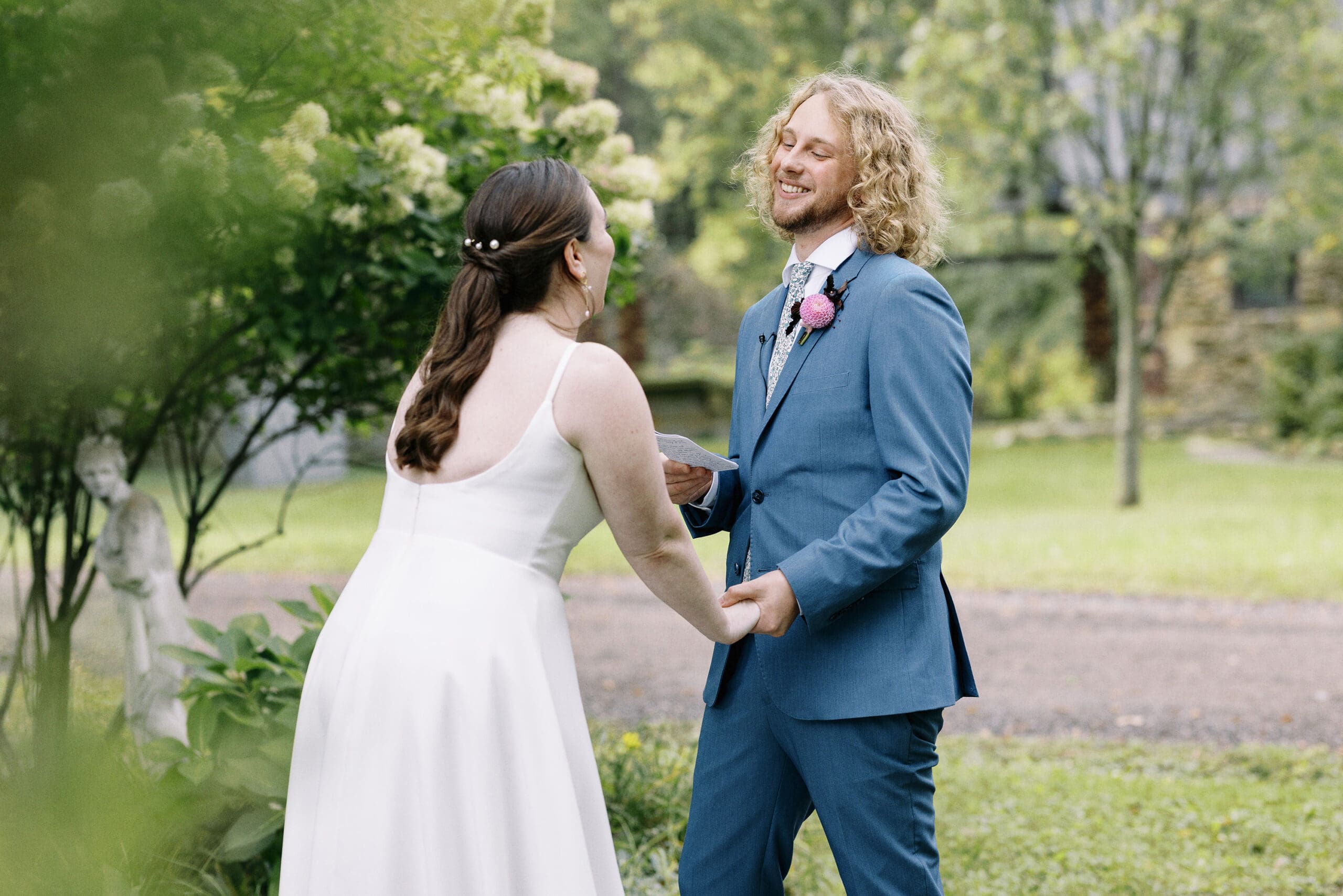 Bride and groom portraits exchanging vows outside of the Outing Lodge in Stillwater, MN. 