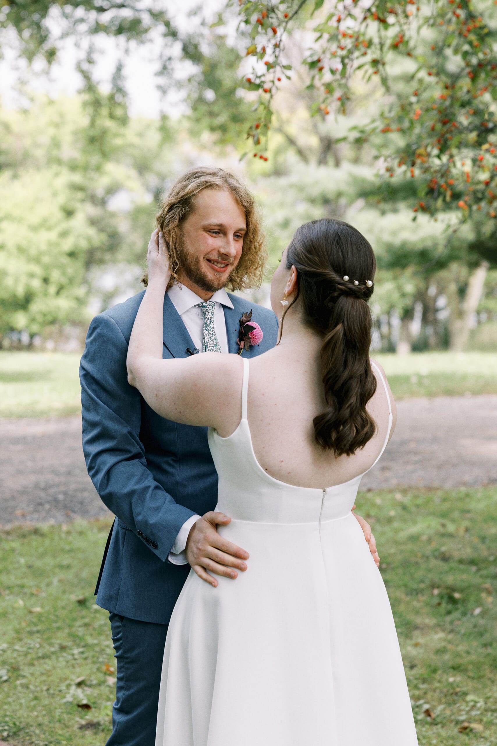 Bride and groom crying during portraits of the vows outside of the Outing Lodge in Stillwater, MN. 