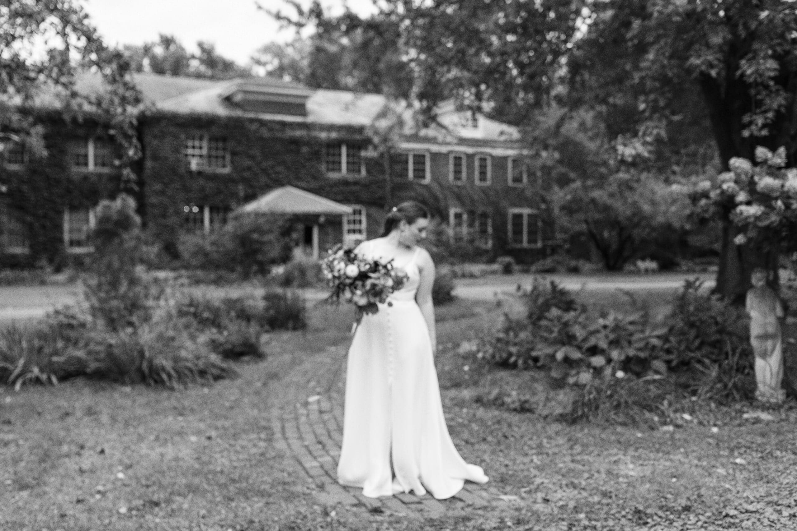 Bridal portrait outside the front of the outing lodge wedding venue in stillwater, MN. 