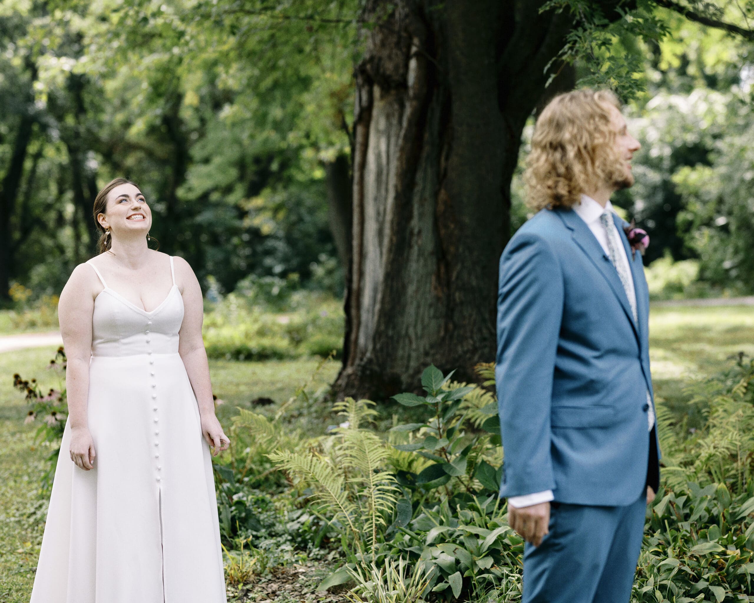 Bride and groom first look portraits outside of the Outing Lodge in Stillwater, MN. 