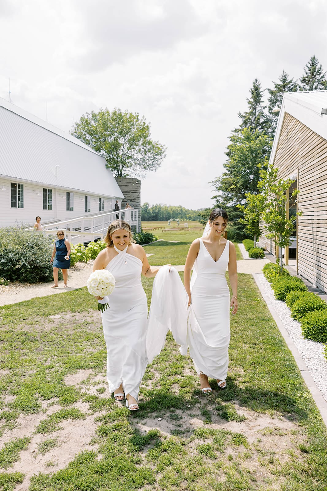 Bride heading to first look portraits during summer wedding day at ivory north in Mora, MN. 