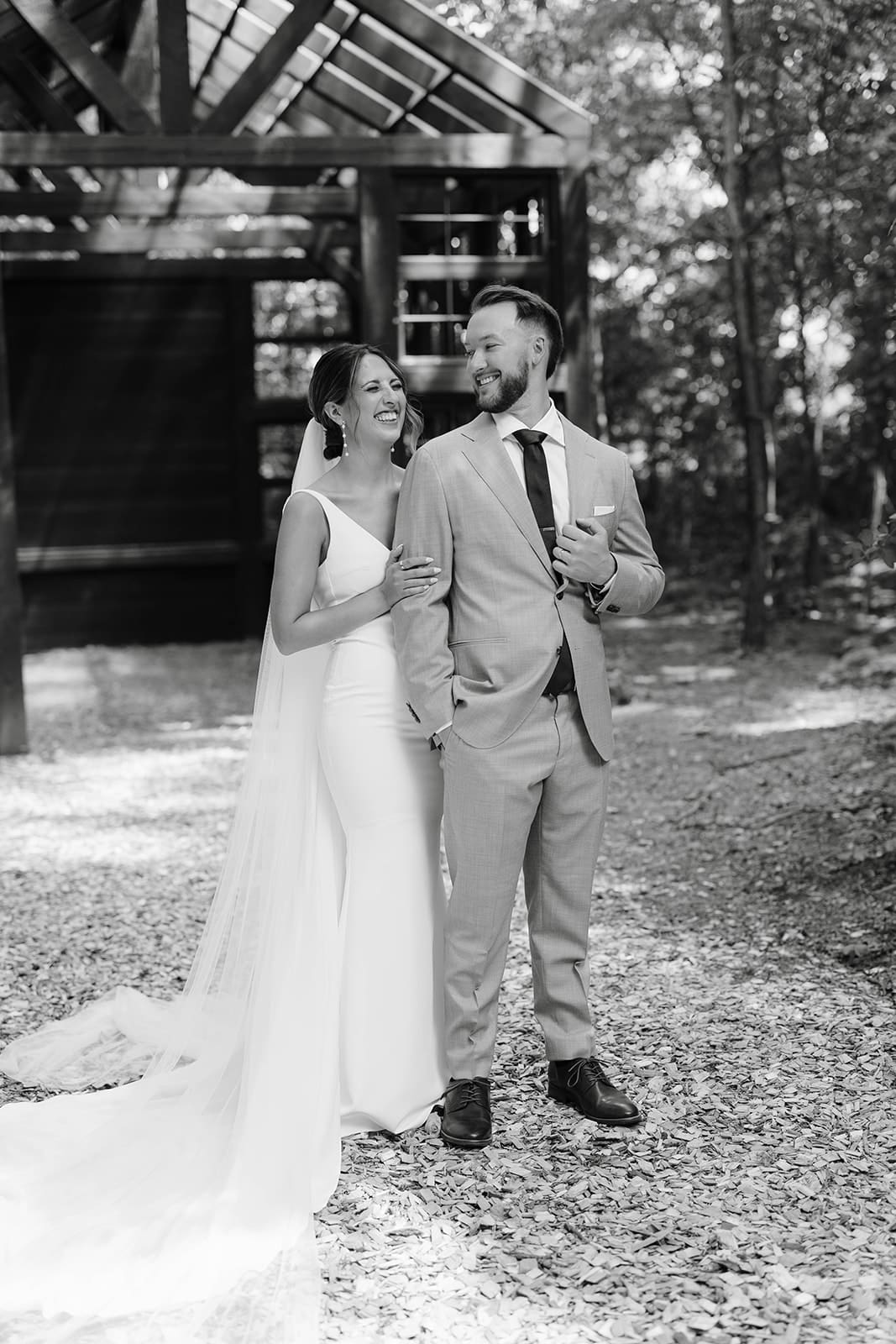 Candid bride and groom portraits in the woods at Ivory North wedding venue in Minnesota. 