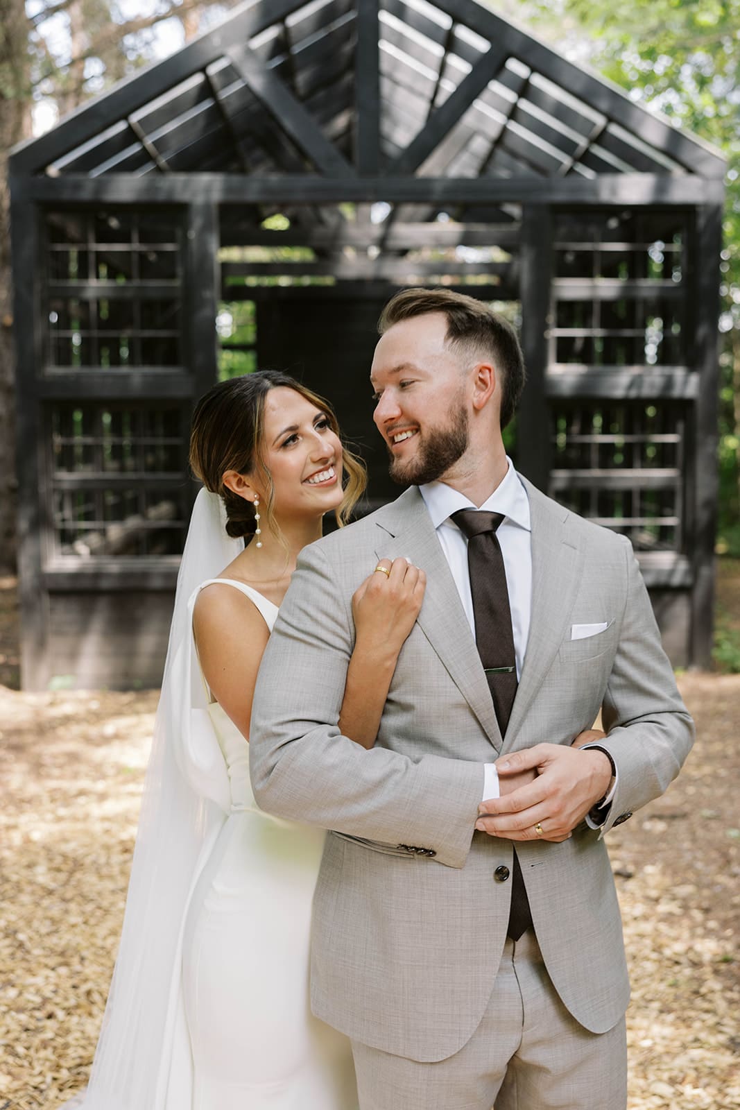 Candid bride and groom portraits in the woods at Ivory North wedding venue in Minnesota. 