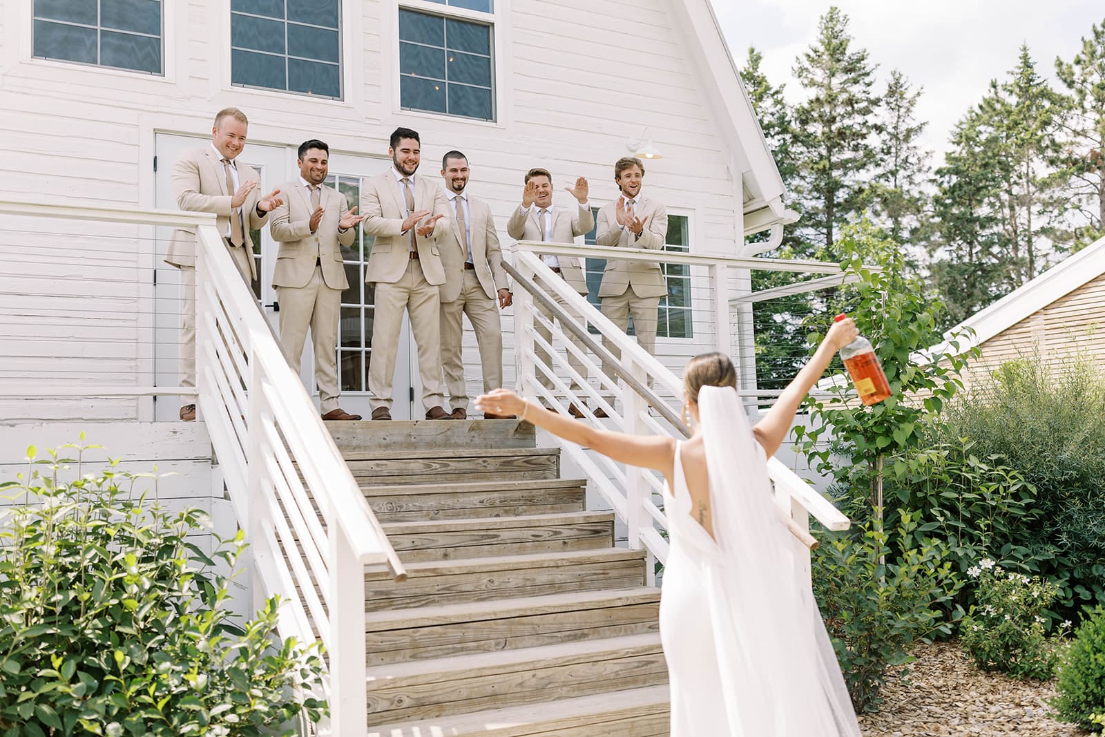 Candid wedding party photo at Ivory North venue in Central Minnesota. Photo by Tom Thornton Photography.  