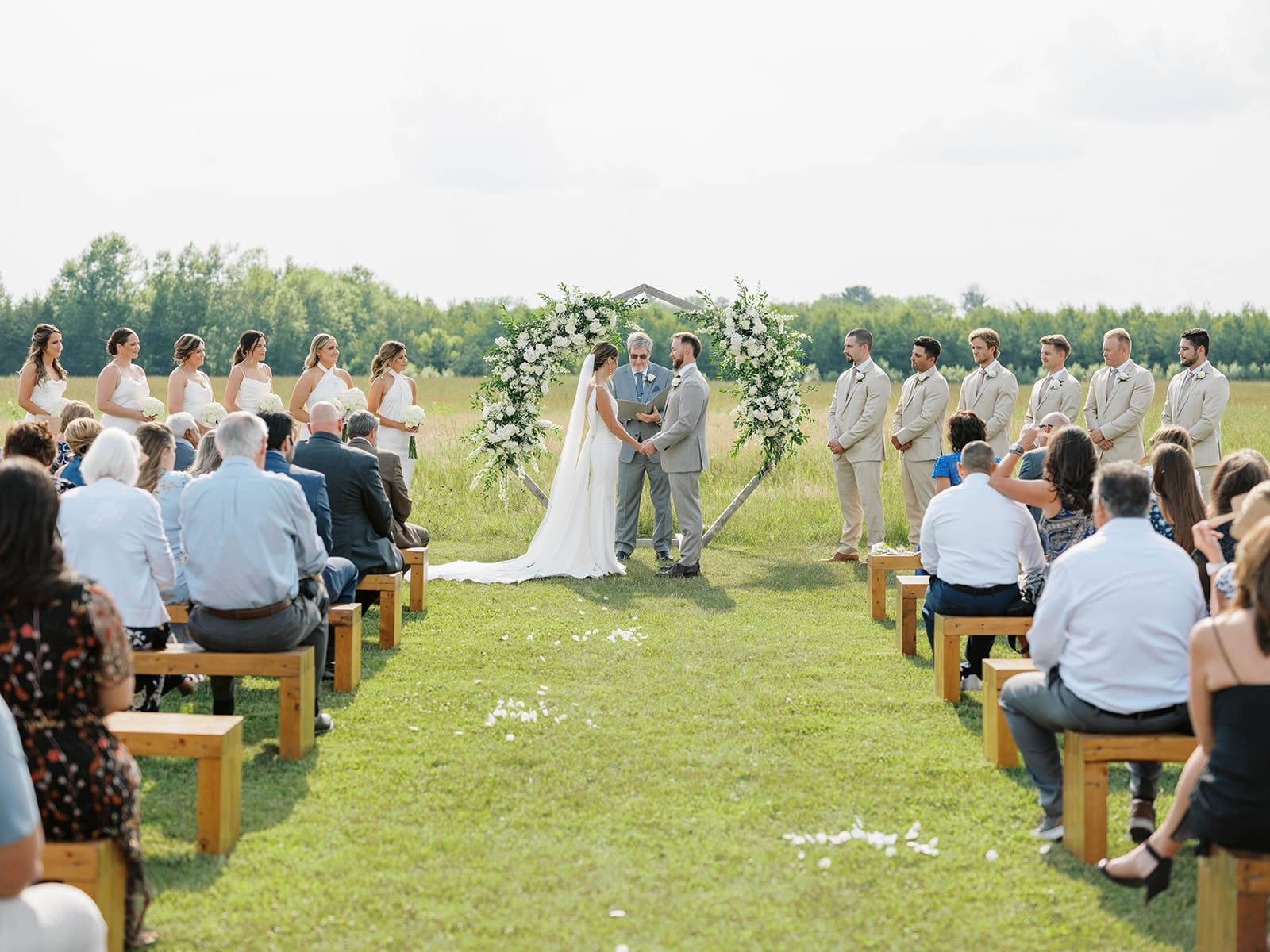 Summer ceremony in the meadow at Ivory North wedding venue in Mora, MN.