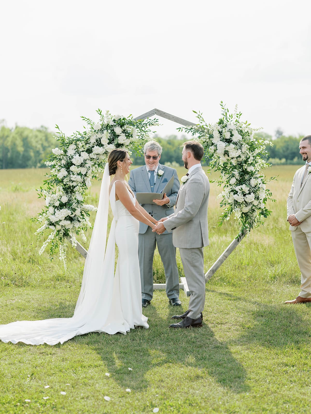 Summer ceremony in the meadow at Ivory North wedding venue in Mora, MN.