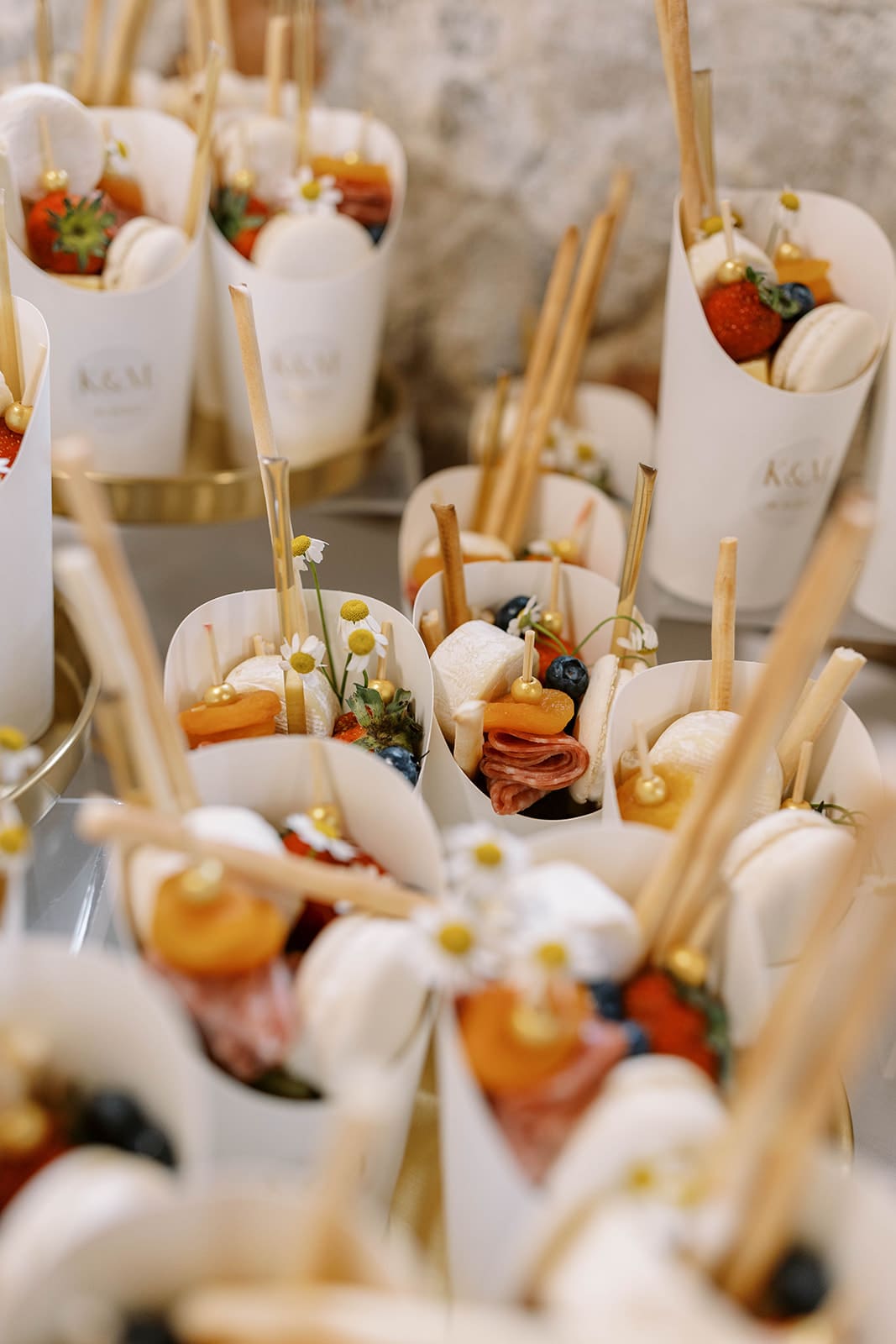 Photo of cocktail hour snacks at an Ivory North wedding reception in the summer. 