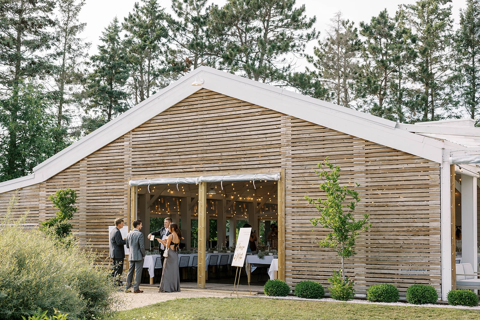 guests mingling at reception during an Ivory North wedding in Mora, MN. 
