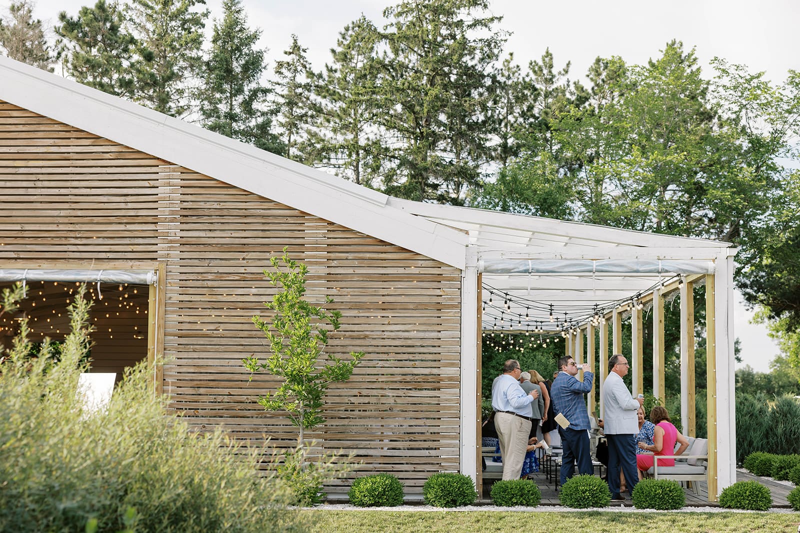 guests mingling at reception during an Ivory North wedding in Mora, MN. 