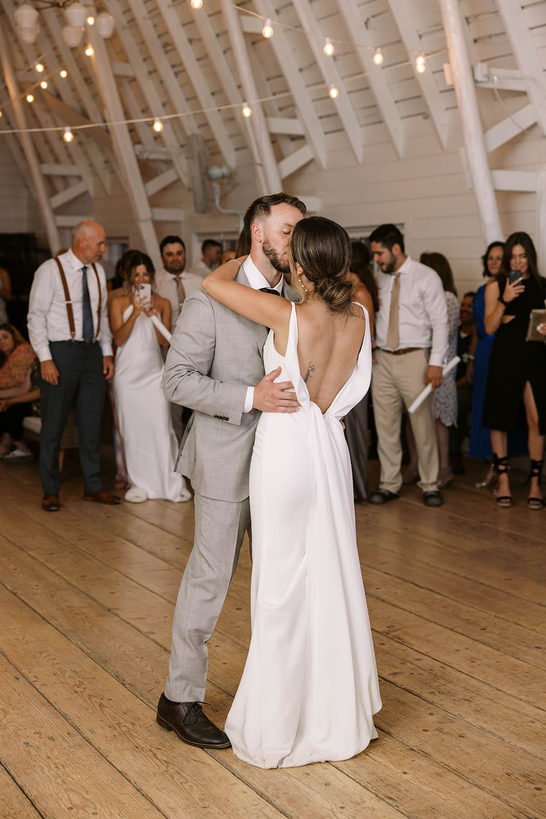 Bride and groom first dance in the white barn at Ivory North in Mora, MN. 