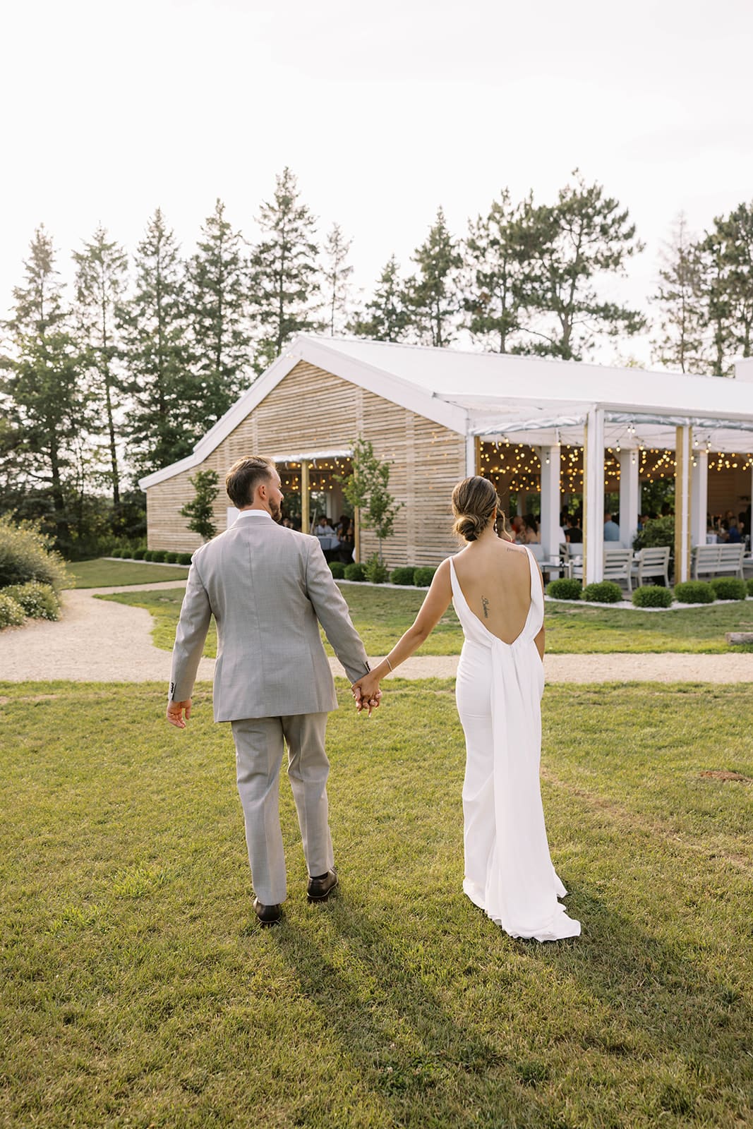 Bride and groom golden hour portraits in the field at Ivory North wedding venue. 