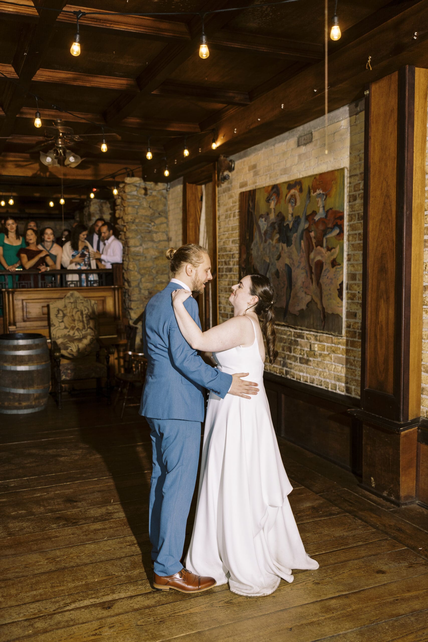 Bride and Groom sharing their first dance at their reception at The outing lodge. 