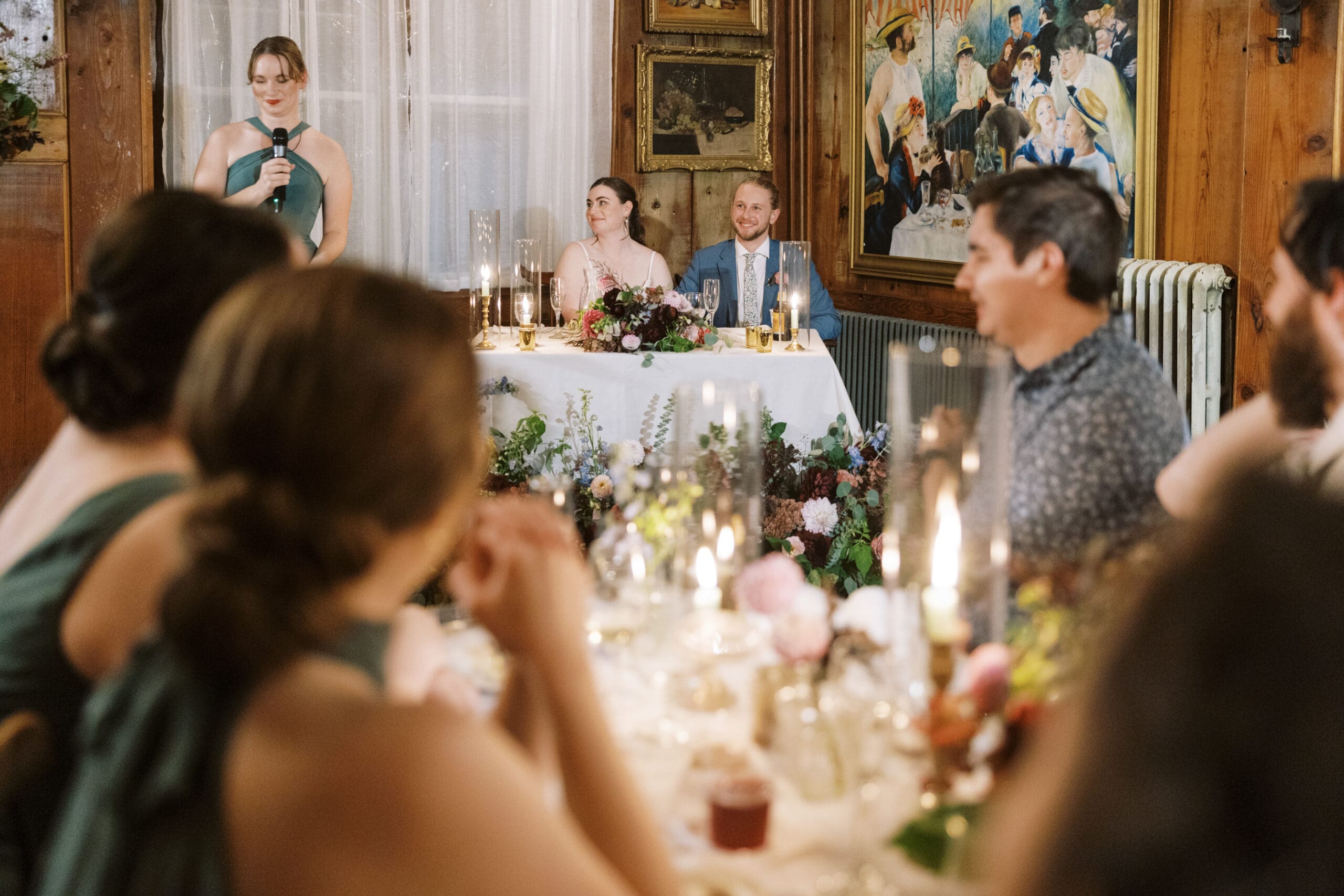 Wedding reception speeches under candlelight for a wedding at the outing lodge.