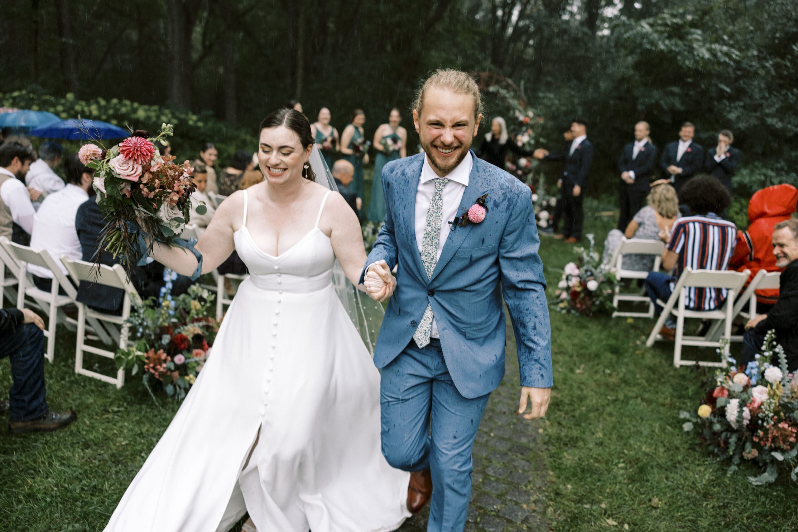 Bride and Groom leaving their garden wedding ceremony at the outing lodge in stillwater, Minnesota. 