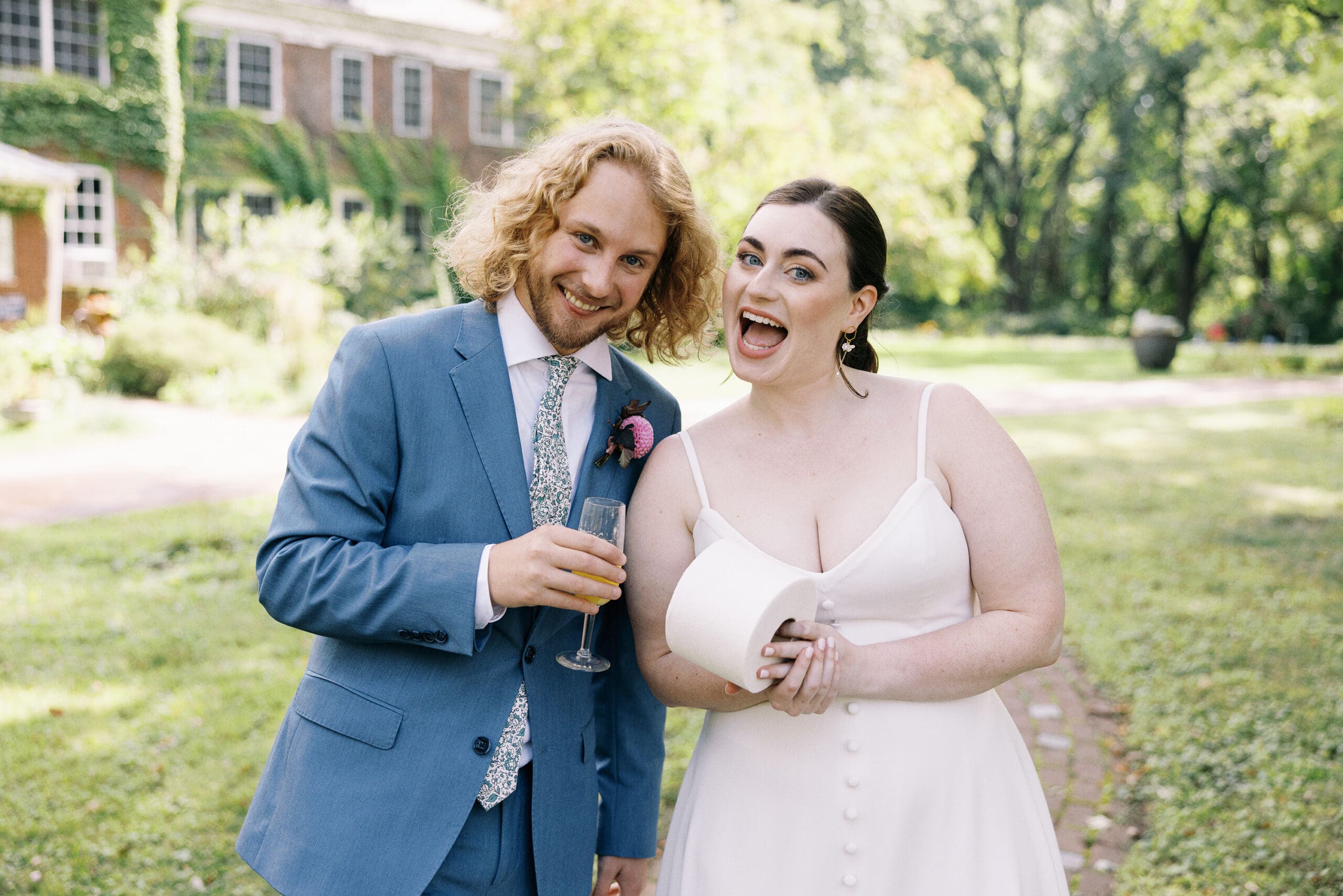 Candid bridal portraits outside the front of the outing lodge wedding venue in Stillwater, MN. 