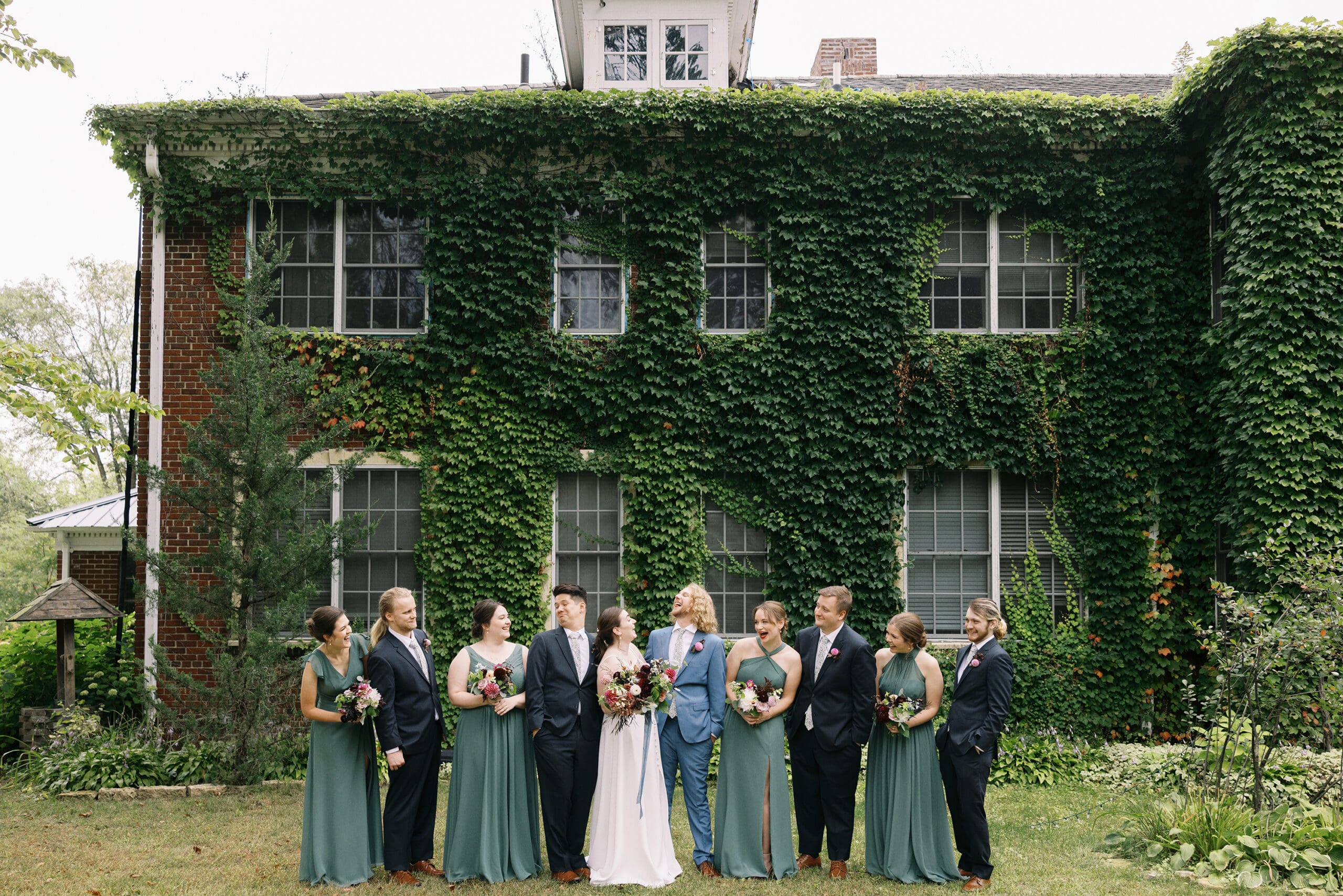 Wedding party portraits outside the ivy wall at the Outing Lodge in Stillwater, MN. 