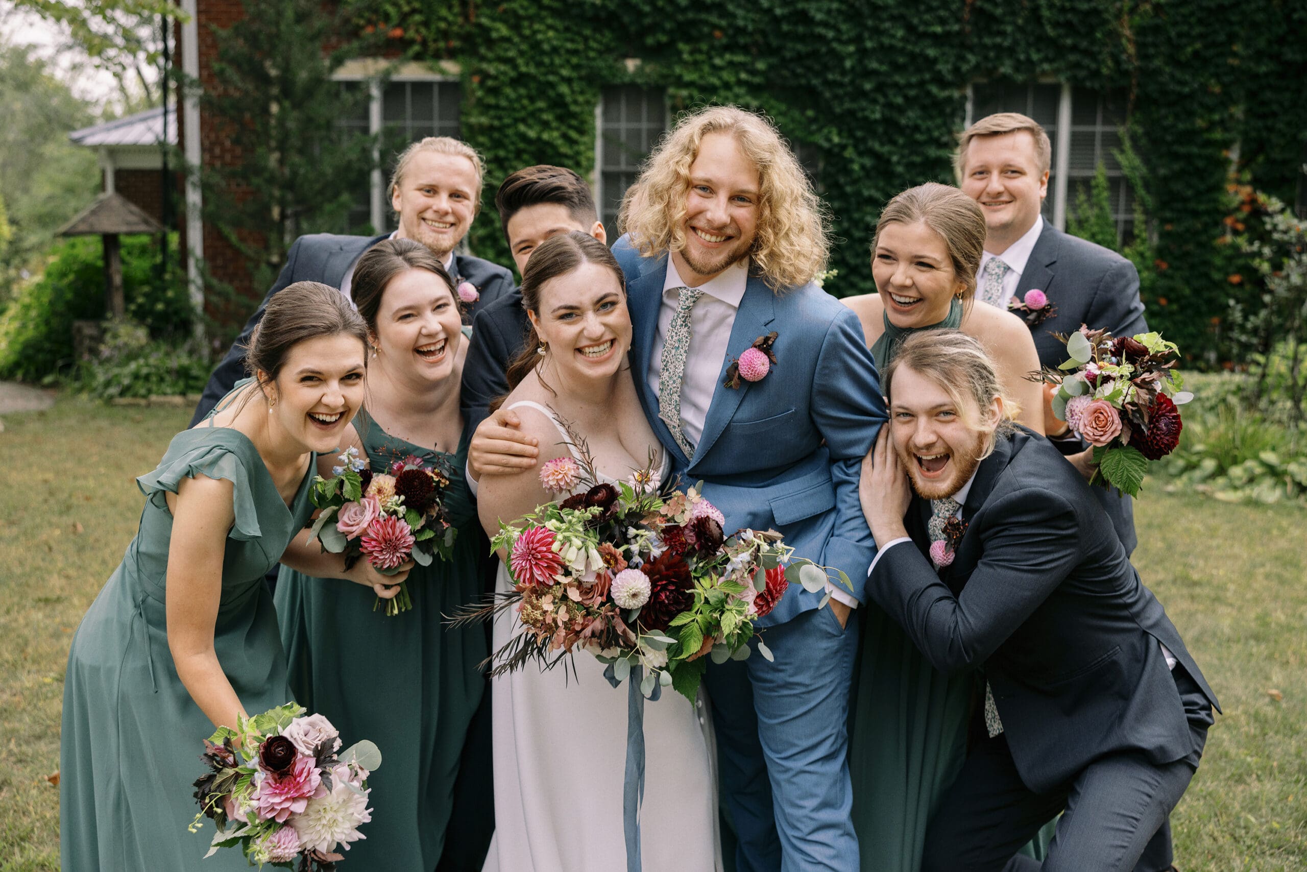 Candid wedding party portraits outside the ivy wall at the Outing Lodge in Stillwater, MN. 