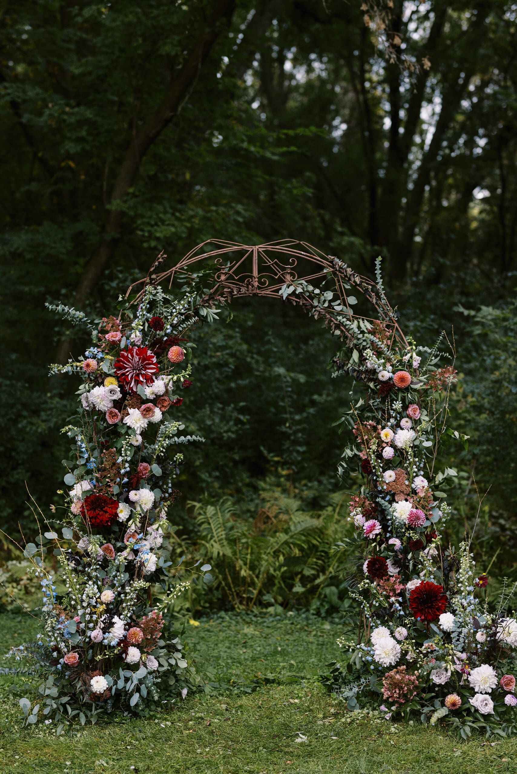 Flower arch Garden wedding ceremony at The Outing Lodge in Stillwater, MN. 