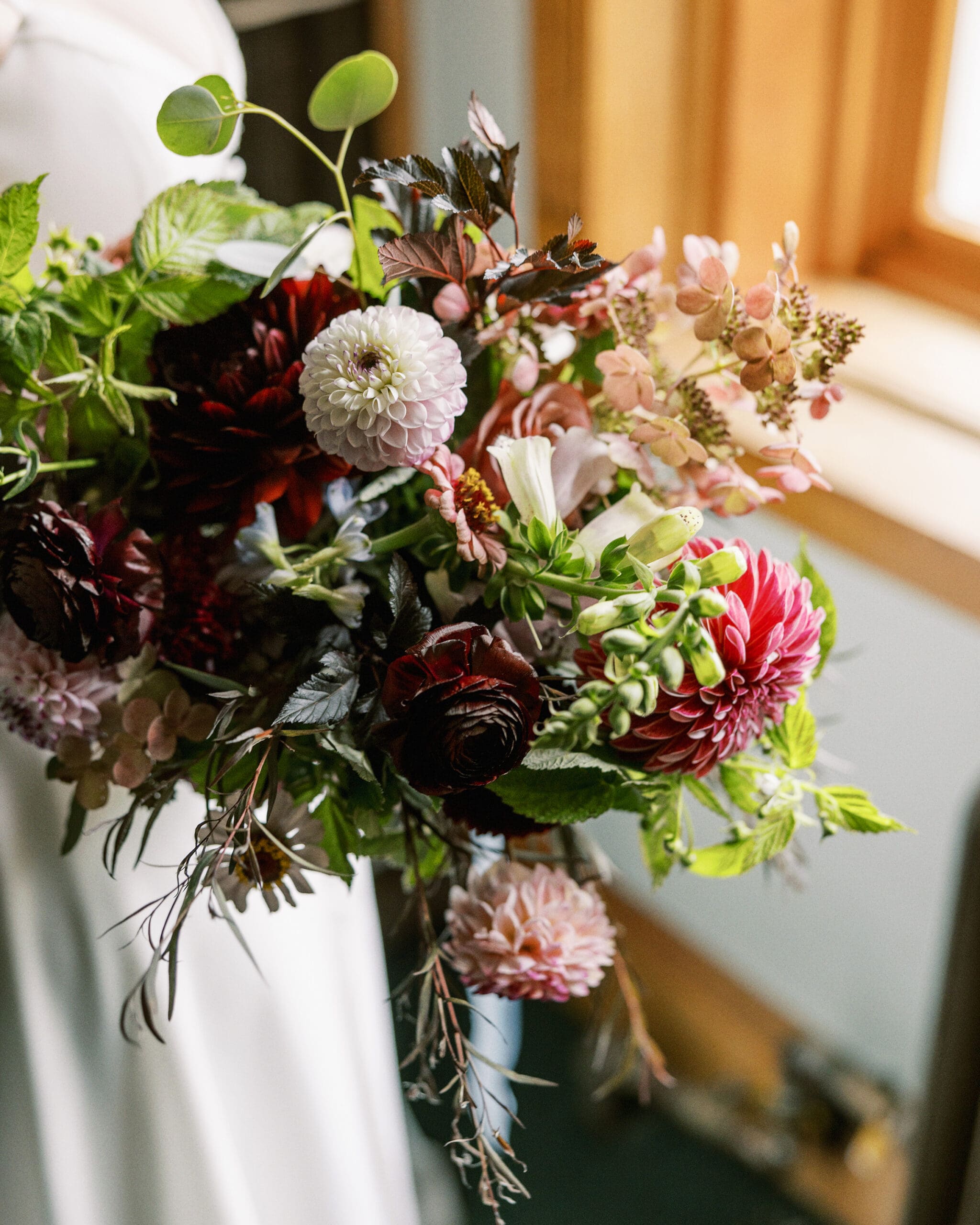 Bridal bouquet photo in the library at the Outing Lodge. 