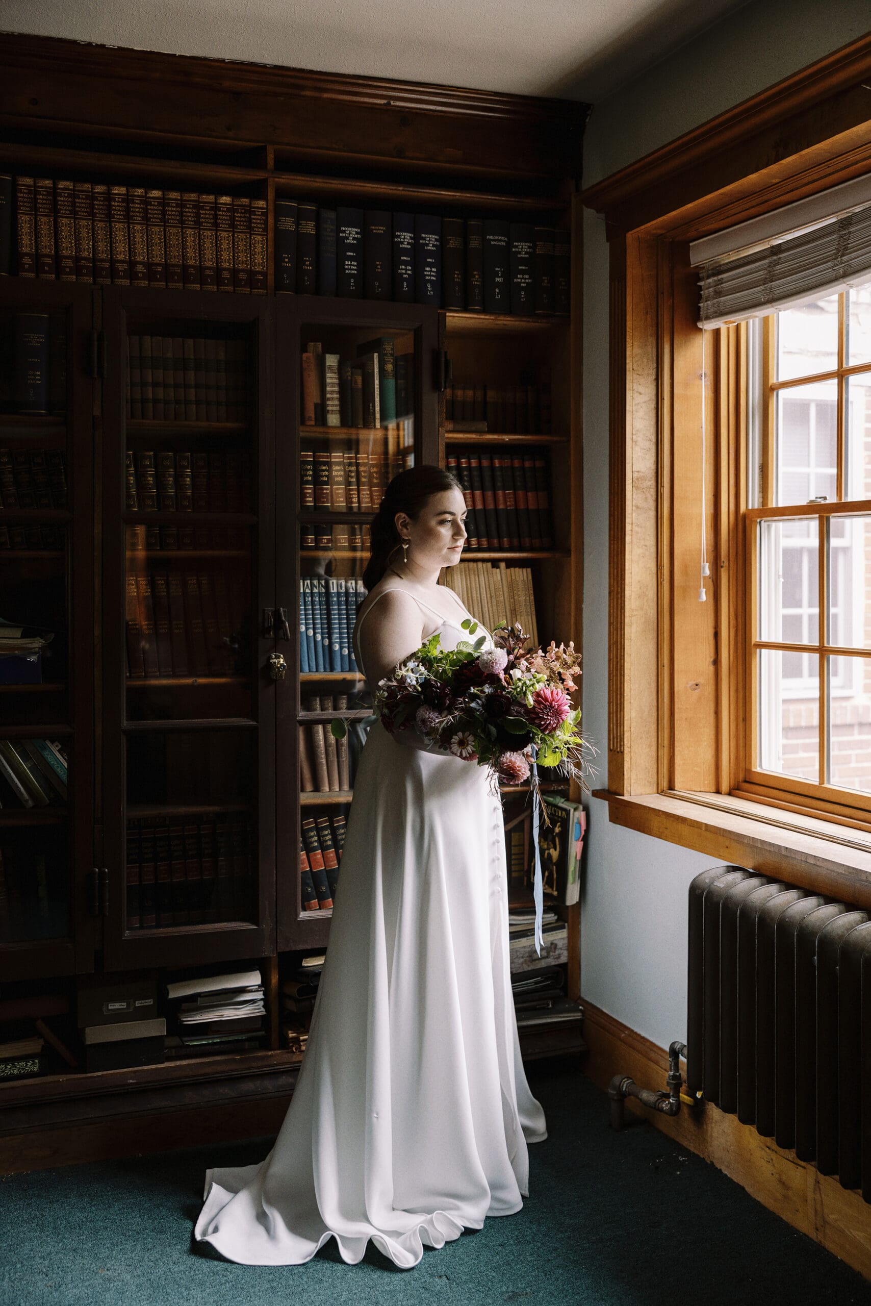 Bridal wedding portrait with flowers in the Library at the Outing Lodge. 